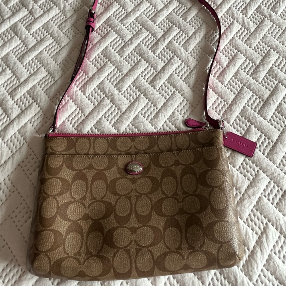 Coach fuchsia, pink, and tan bag / crossbody or over shoulder.